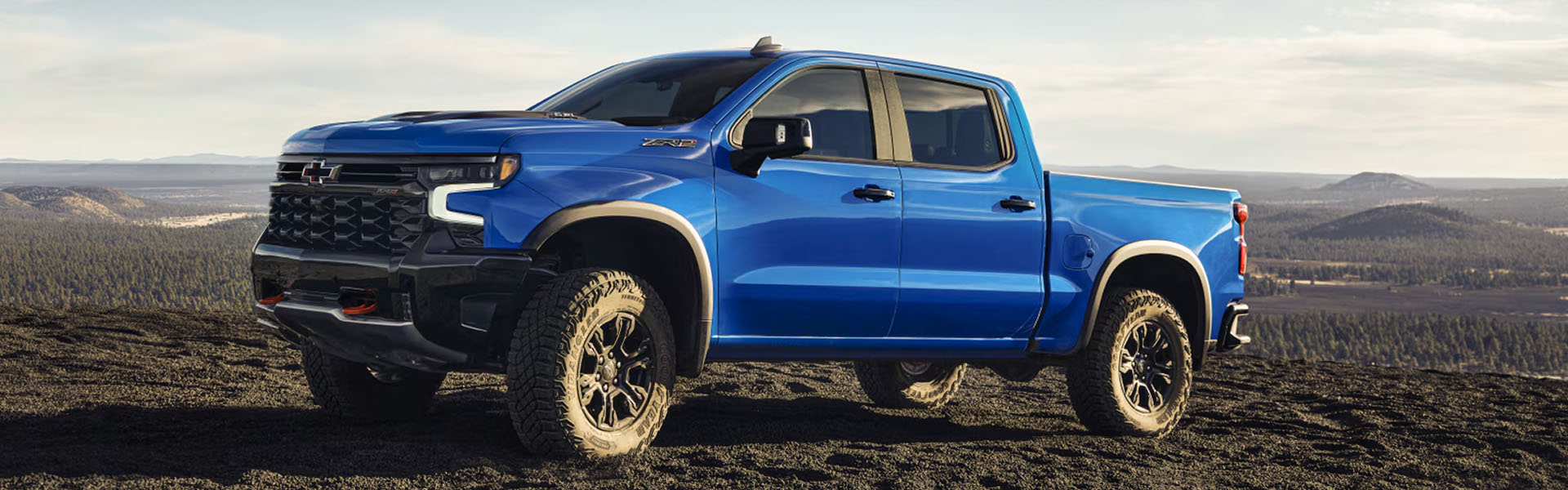 Chevrolet Silverado truck on rugged terrain.